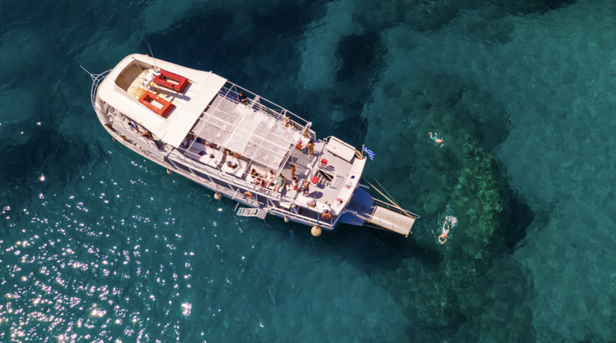 Rhodes: Bay to Bay Swim Cruise with Greek Buffet and Wine